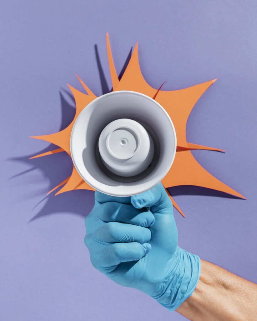 hand-holding-megaphone-with-paper-shape